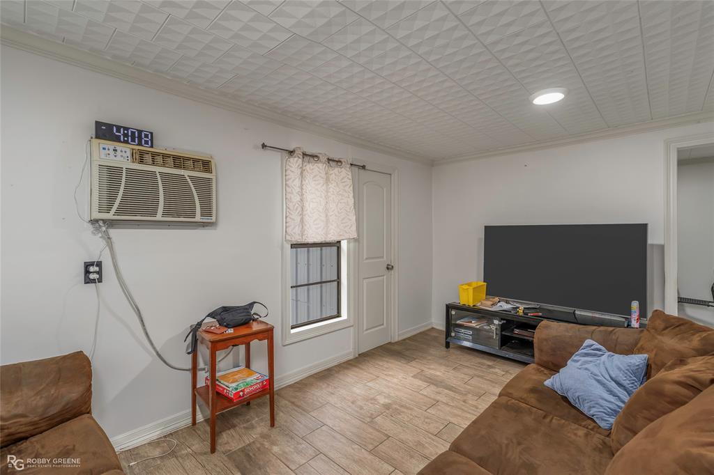 143 New Bethel Booker Road Benton, LA 71006 - Photo 5 of 26 Interior space featuring wood-finish flooring, white walls, and a textured ceiling