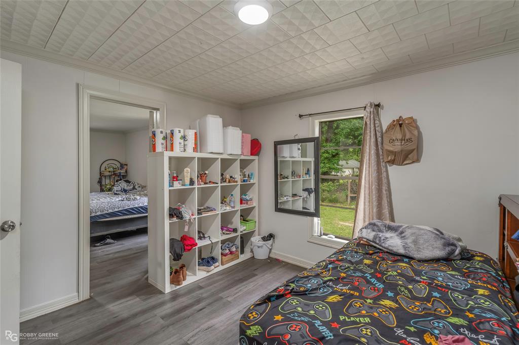 143 New Bethel Booker Road Benton, LA 71006 - Photo 8 of 26 Wood-finish flooring throughout, white walls, and a recessed ceiling light