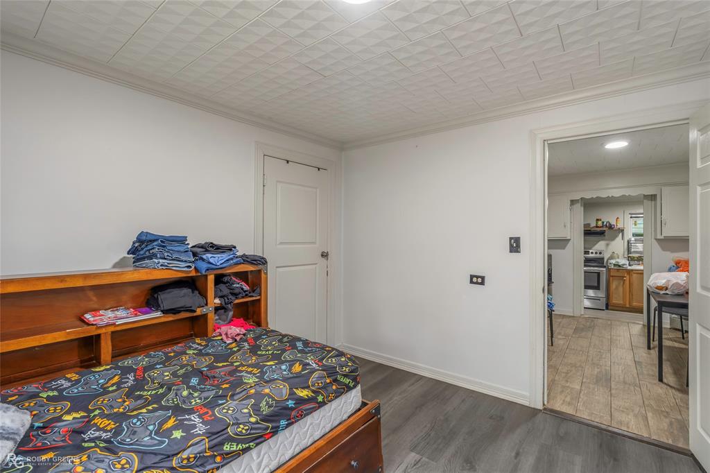 143 New Bethel Booker Road Benton, LA 71006 - Photo 9 of 26 Room with wood-finish flooring and a white paneled ceiling