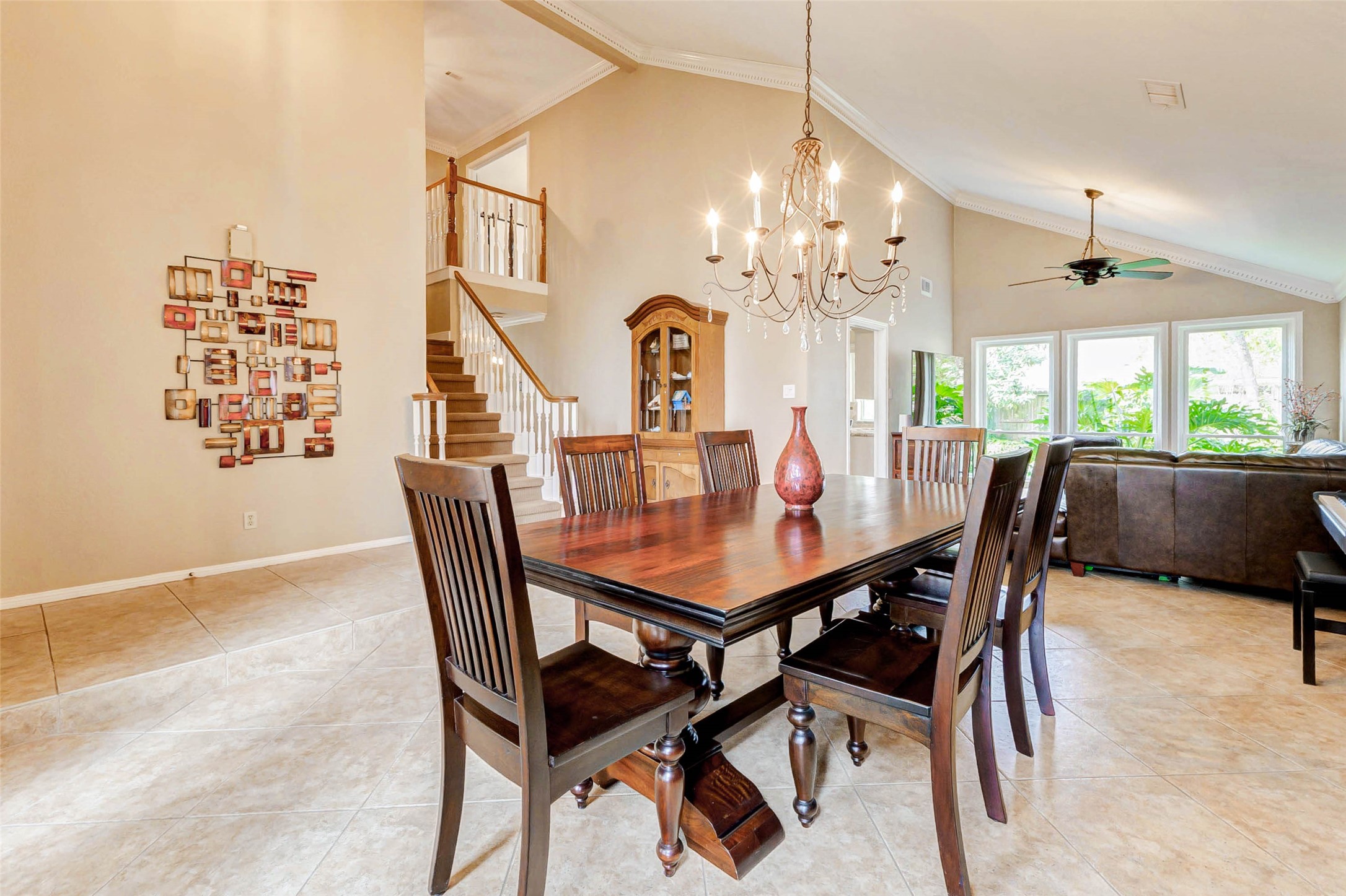 15811 Spring Forest Drive Houston, TX 77059 - Photo 5 of 27 Experience seamless living and entertaining in this elegant space where the formal dining area flows effortlessly into the inviting family room.