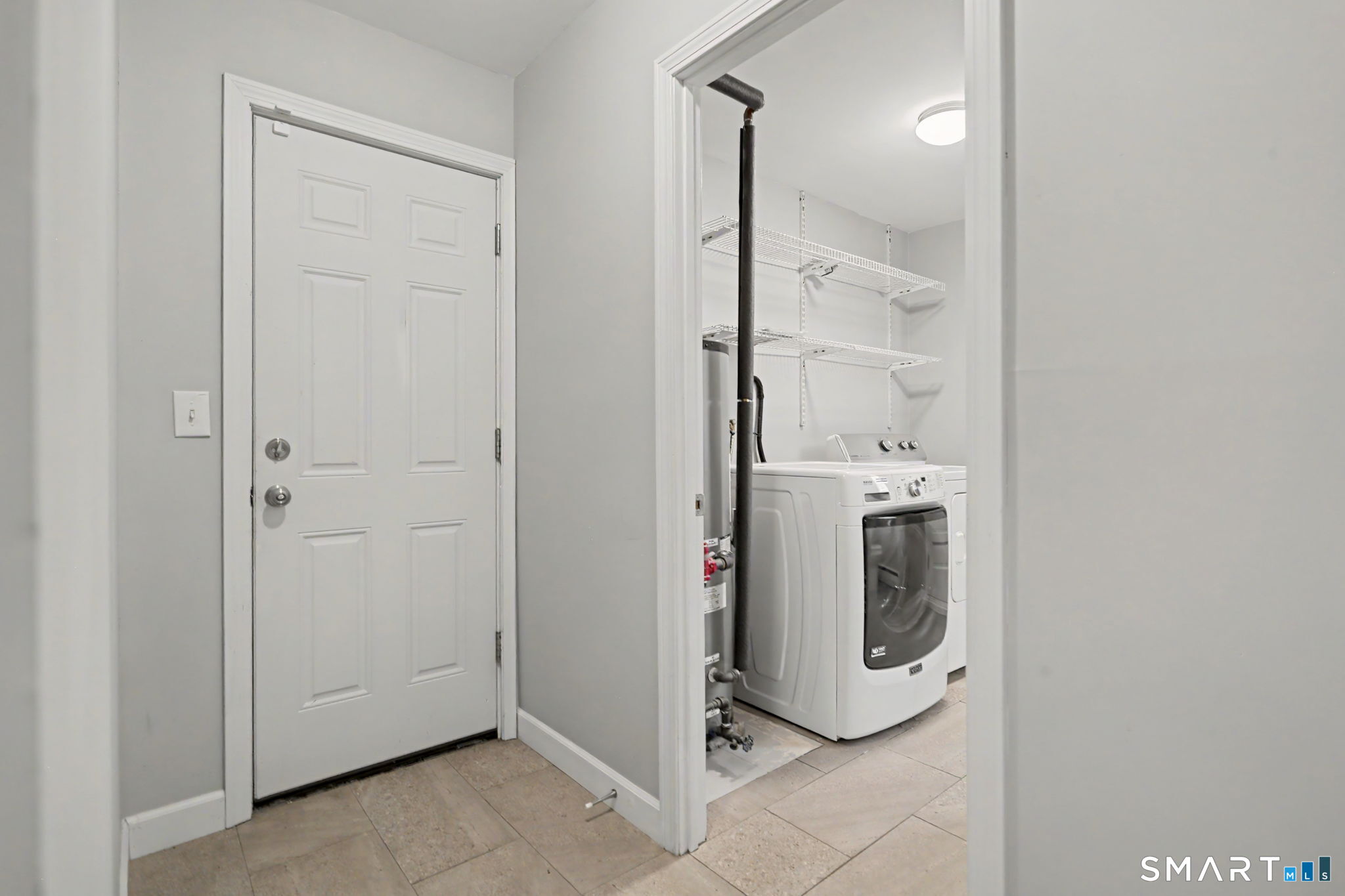 143 Ranch Drive Bridgeport, CT 06606 - Photo 20 of 32 Lower Hallway to access garage