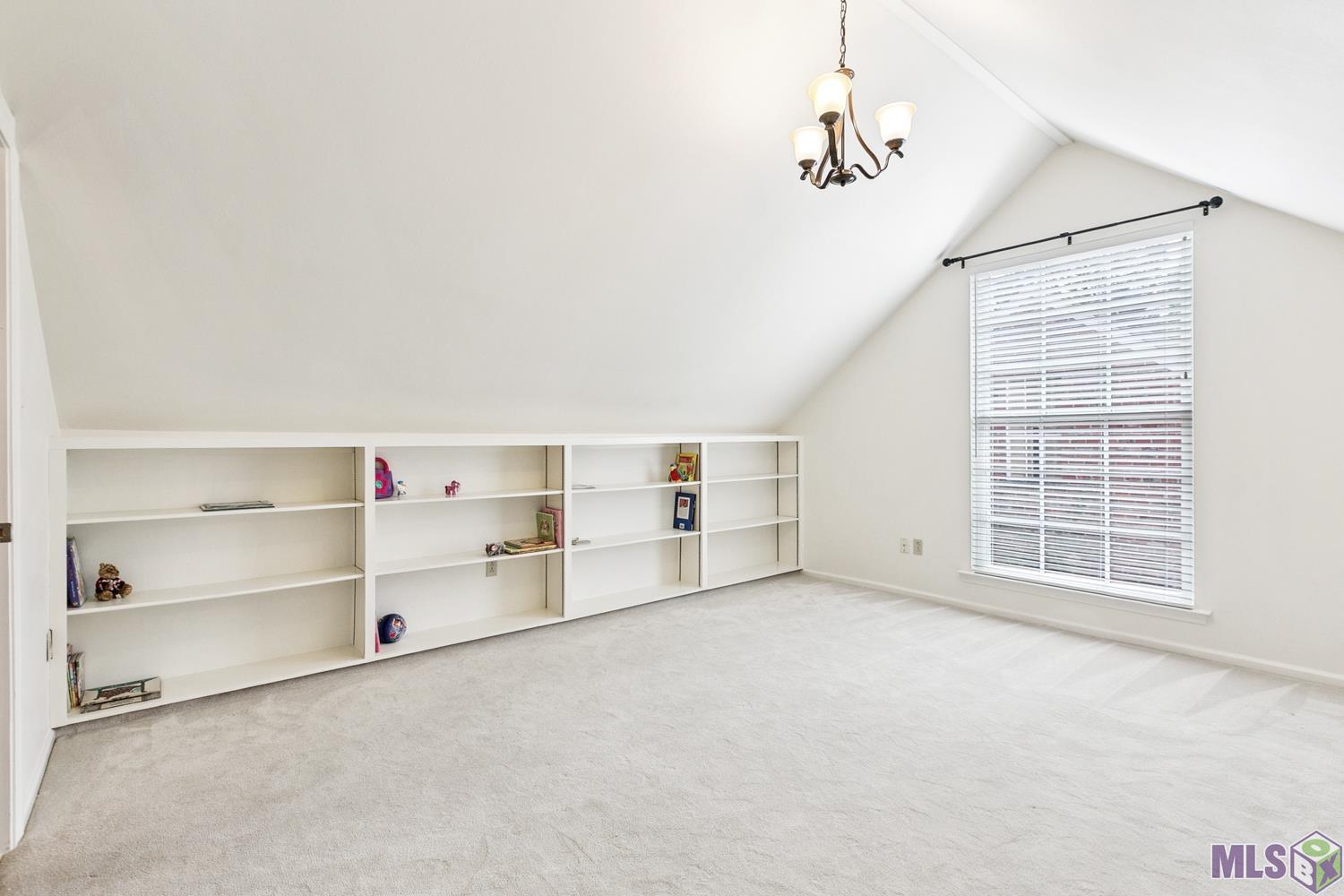 3635 Woodland Ridge Boulevard Baton Rouge, LA 70816 - Photo 13 of 21 PLAYROOM/BONUS ROOM WITH BUILT-INS