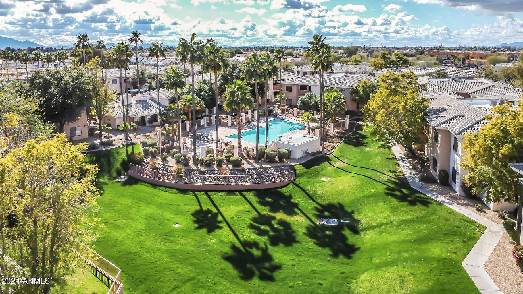 10030 West Indian School Road, Unit 128 Phoenix, AZ 85037 - Photo 2 of 16 Desert Breeze Aerial of Pool