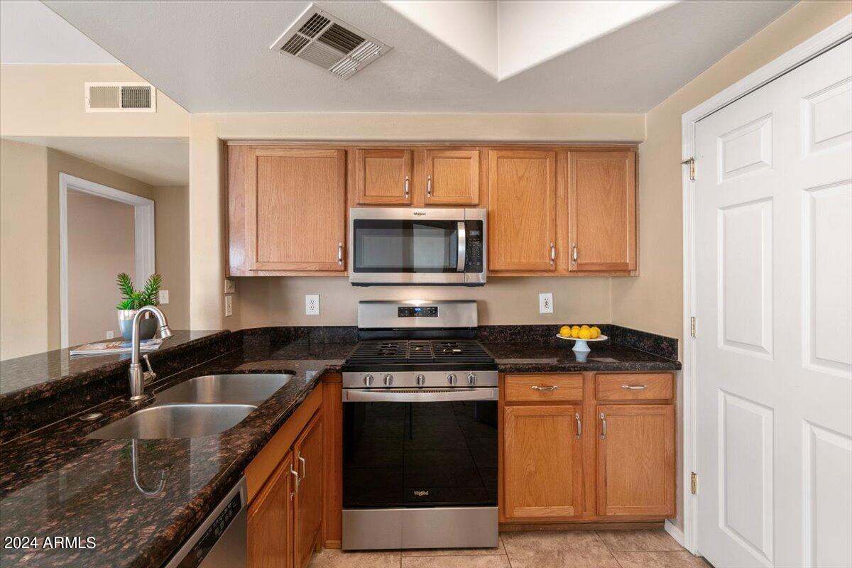 10030 West Indian School Road, Unit 128 Phoenix, AZ 85037 - Photo 6 of 16 Kitchen with Large Pantry