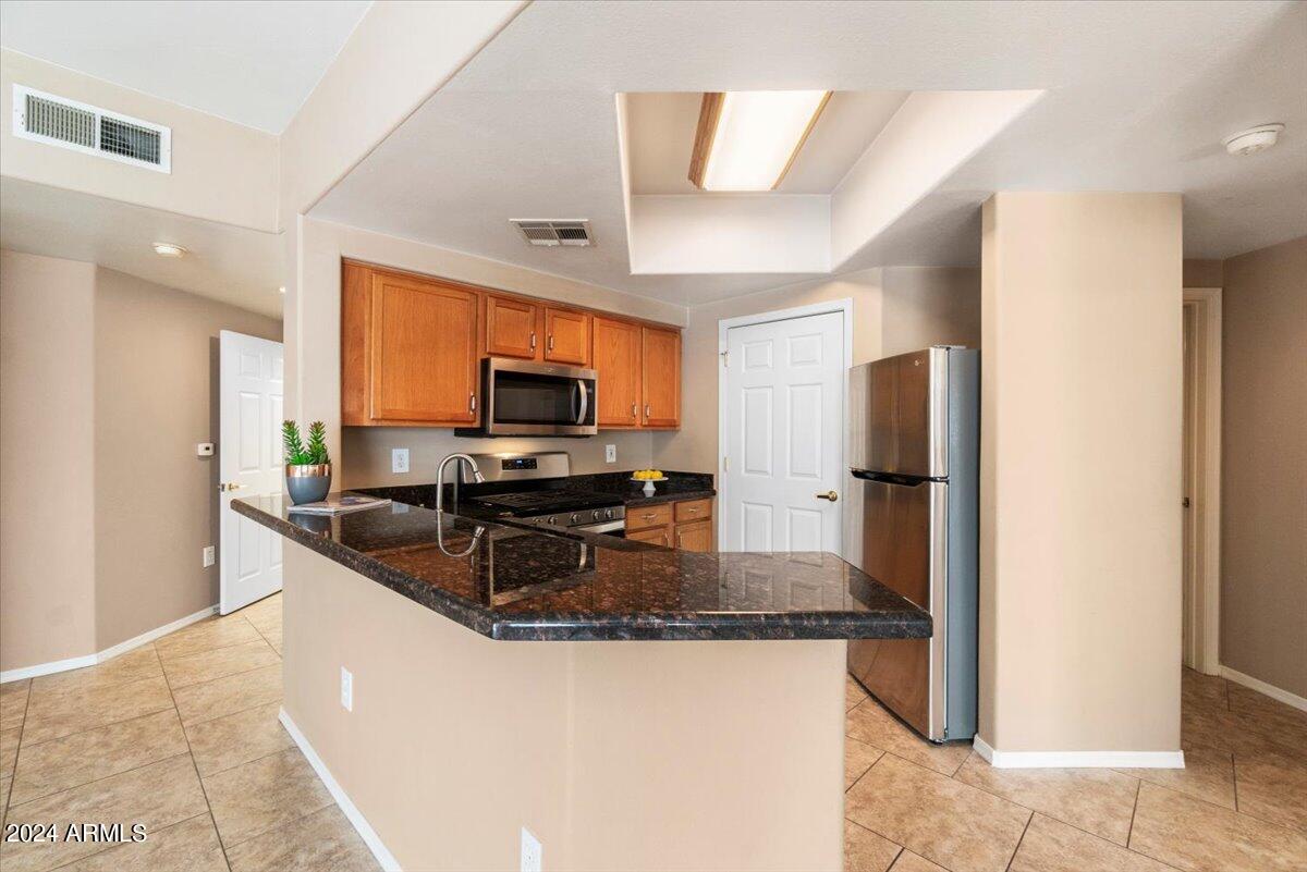 10030 West Indian School Road, Unit 128 Phoenix, AZ 85037 - Photo 7 of 16 Kitchen Includes Appliances