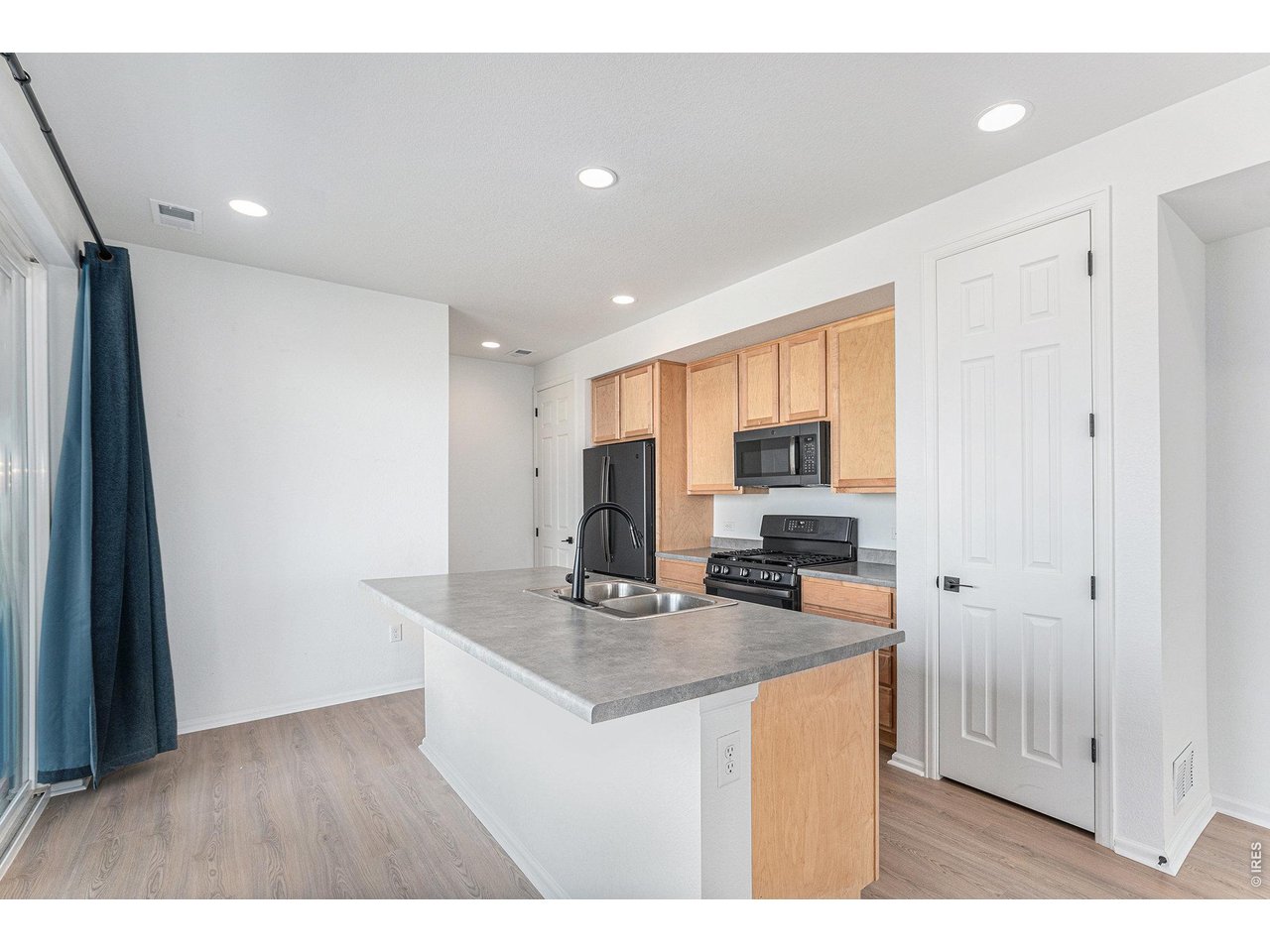 5230 Warrior Street Frederick, CO 80504 - Photo 2 of 12 Kitchen with new vinyl flooring