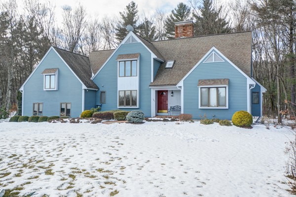 583 Sugar Road Bolton, MA 01740 - Photo 1 of 30 a view of a house with a yard covered in snow