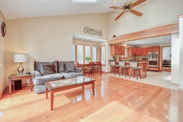583 Sugar Road Bolton, MA 01740 - Photo 11 of 30 a living room with furniture and a wooden floor