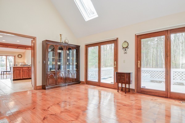 583 Sugar Road Bolton, MA 01740 - Photo 14 of 30 a view of an empty room with large windows