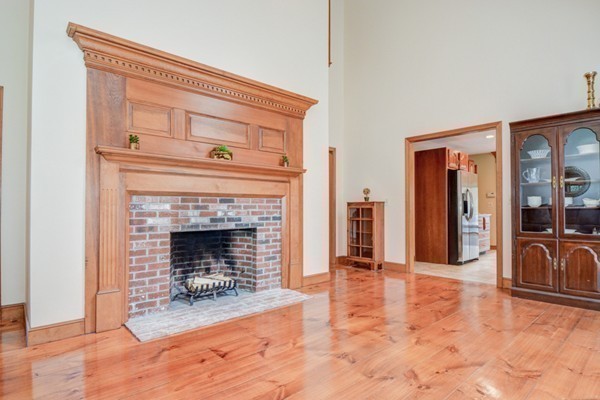 583 Sugar Road Bolton, MA 01740 - Photo 15 of 30 a living room with furniture and a fireplace