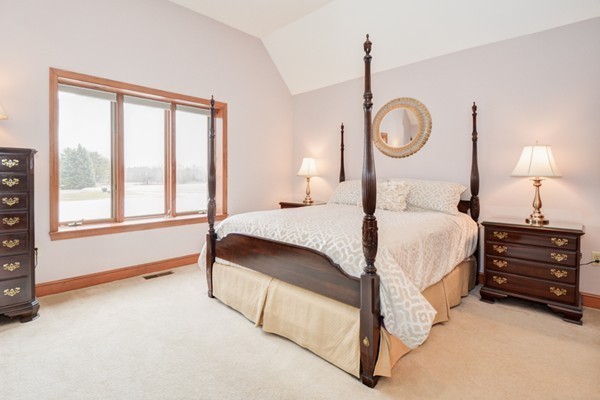 583 Sugar Road Bolton, MA 01740 - Photo 17 of 30 a bedroom with a bed lamp closet and window