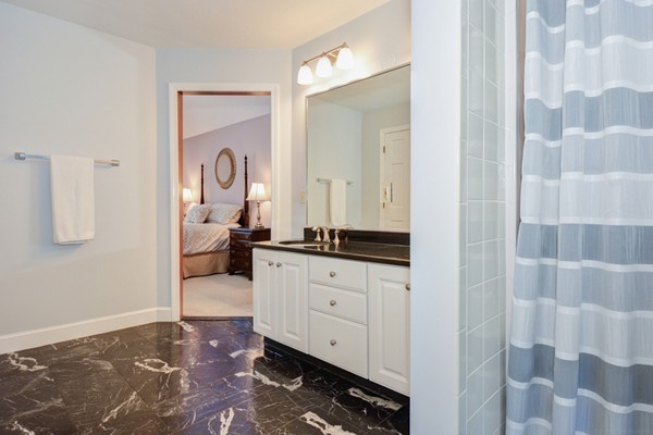 583 Sugar Road Bolton, MA 01740 - Photo 18 of 30 a spacious bathroom with a double vanity sink and a mirror