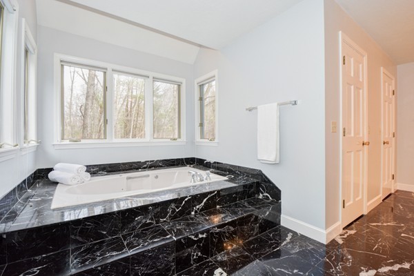 583 Sugar Road Bolton, MA 01740 - Photo 19 of 30 a bathroom with a sink and a window