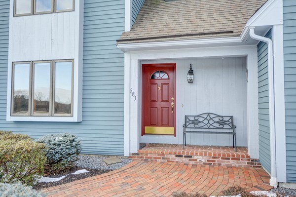 583 Sugar Road Bolton, MA 01740 - Photo 2 of 30 a front view of a house with a yard