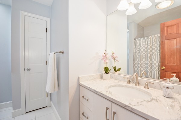 583 Sugar Road Bolton, MA 01740 - Photo 23 of 30 a bathroom with a granite countertop sink and a mirror