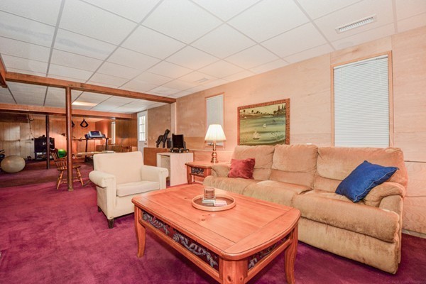 583 Sugar Road Bolton, MA 01740 - Photo 27 of 30 a living room with furniture a table and a potted plant