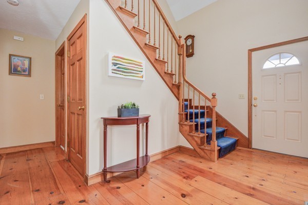 583 Sugar Road Bolton, MA 01740 - Photo 3 of 30 a view of entryway and hall with wooden floor
