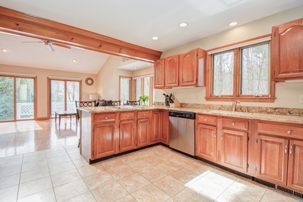 583 Sugar Road Bolton, MA 01740 - Photo 8 of 30 a large kitchen with granite countertop a sink window and cabinets