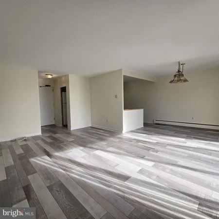 a view of a livingroom and a bathroom