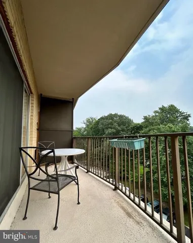 a view of balcony with furniture