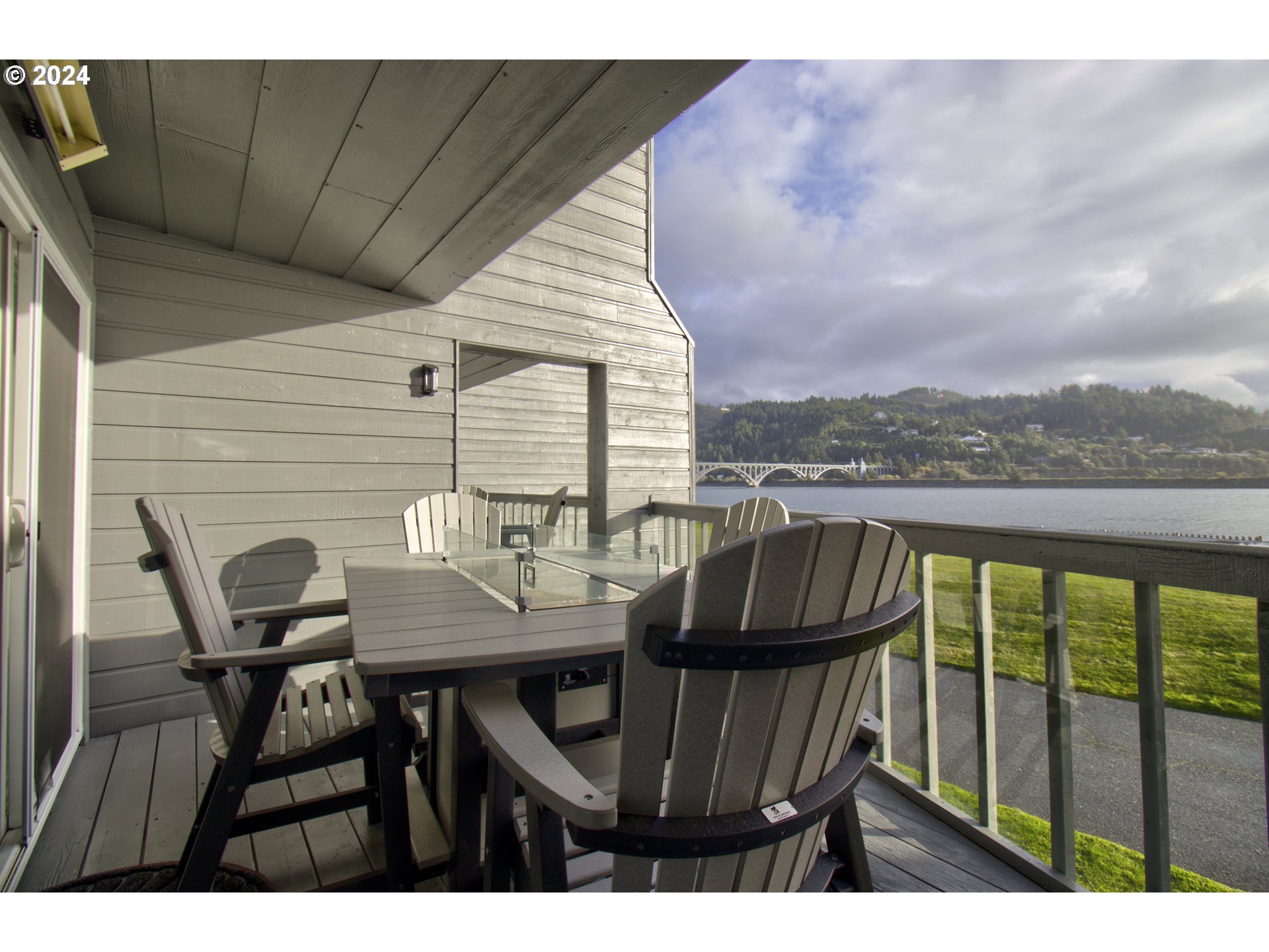 a view of a balcony with table and chairs