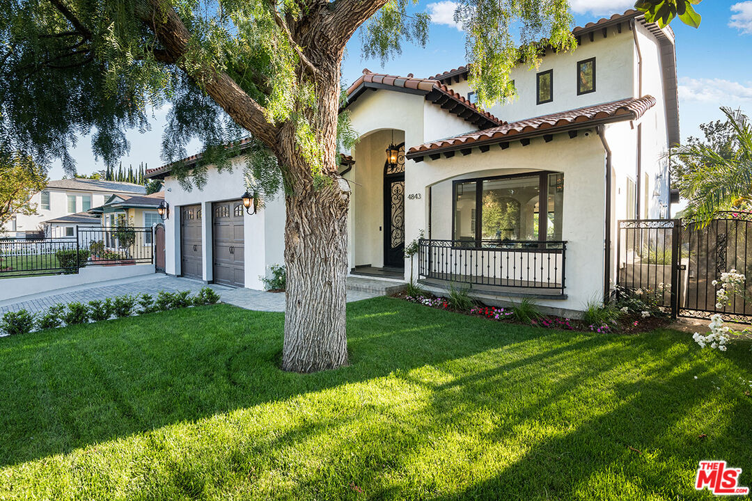 4843 Ledge Avenue Toluca Lake, CA 91601 - Photo 1 of 31 a front view of a house with garden