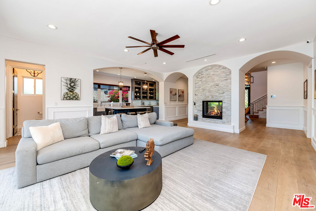 4843 Ledge Avenue Toluca Lake, CA 91601 - Photo 11 of 31 a living room with furniture and a wooden floor