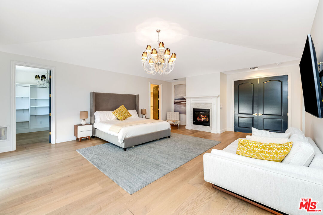 4843 Ledge Avenue Toluca Lake, CA 91601 - Photo 17 of 31 a bedroom with a bed and a couch