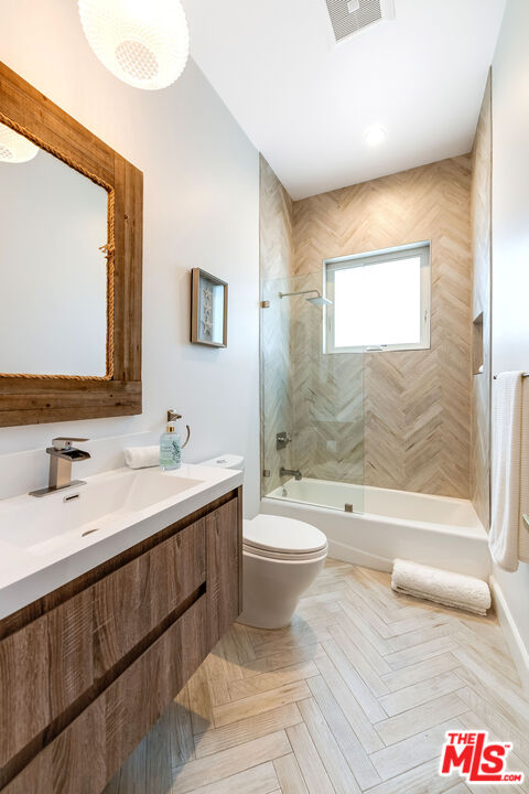 4843 Ledge Avenue Toluca Lake, CA 91601 - Photo 23 of 31 a bathroom with a sink and a mirror