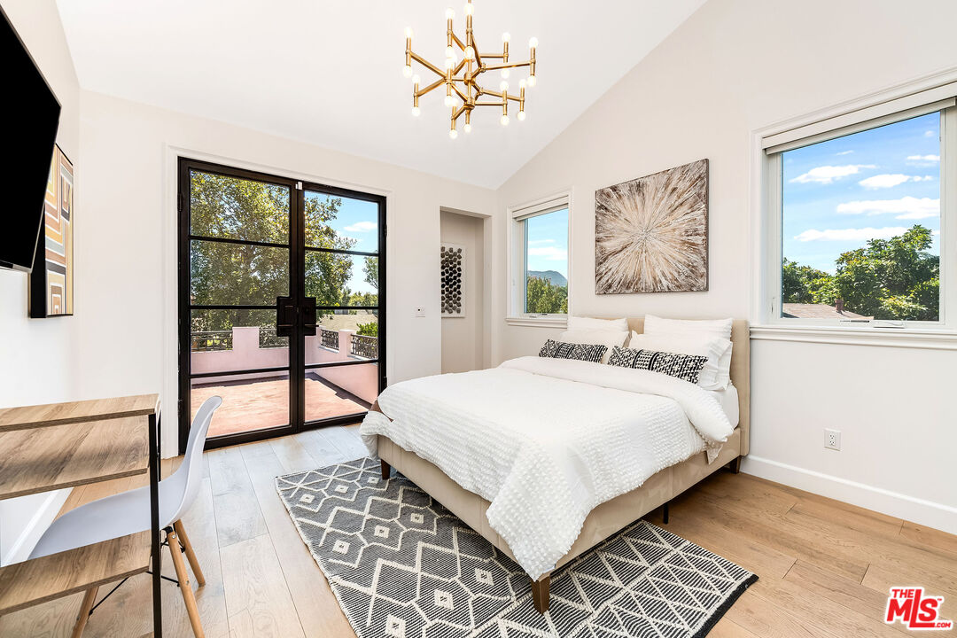 4843 Ledge Avenue Toluca Lake, CA 91601 - Photo 24 of 31 a bedroom with a large bed and a window