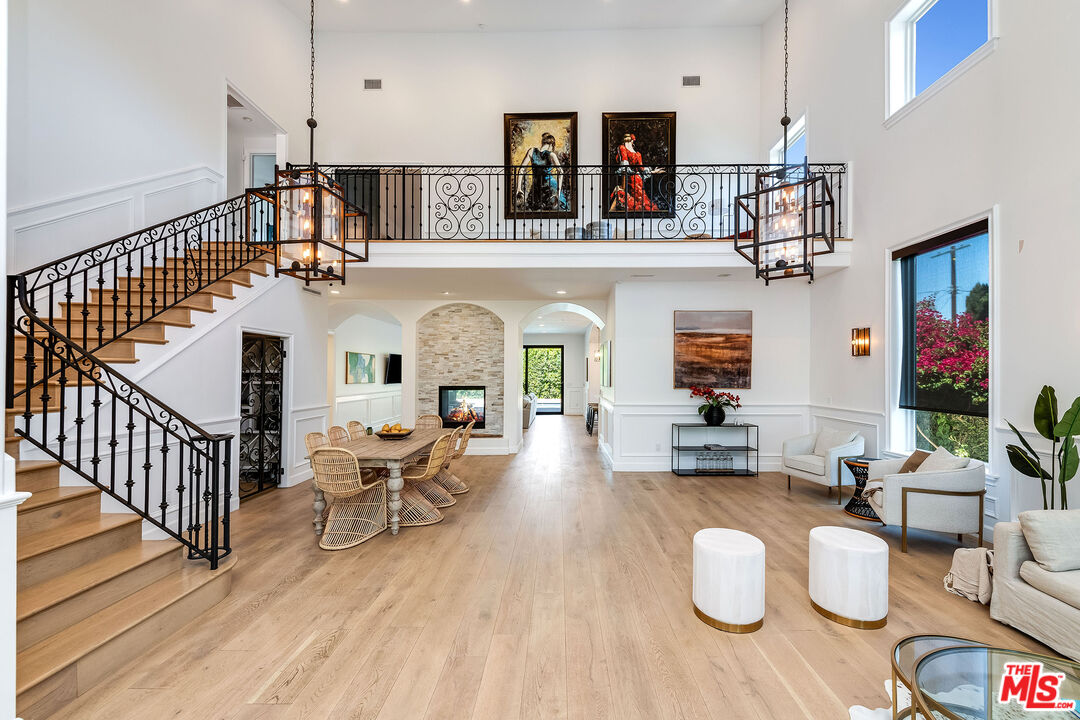 4843 Ledge Avenue Toluca Lake, CA 91601 - Photo 3 of 31 a living room with furniture and a fireplace