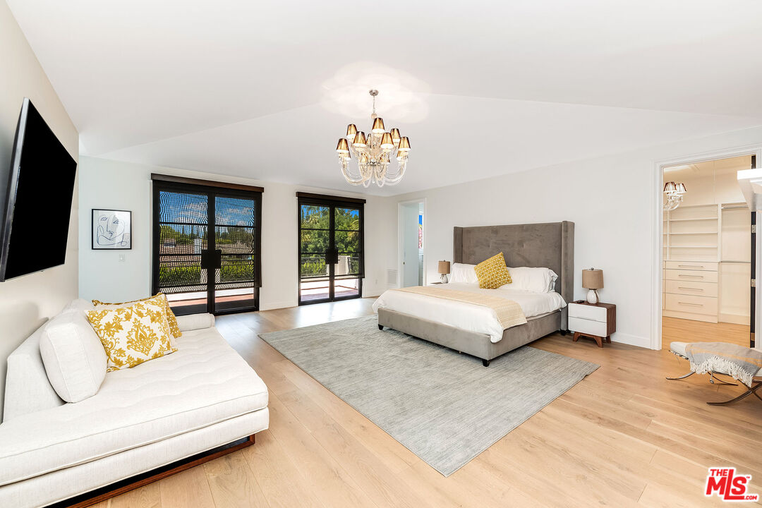 4843 Ledge Avenue Toluca Lake, CA 91601 - Photo 5 of 31 a bedroom with a bed couch and window