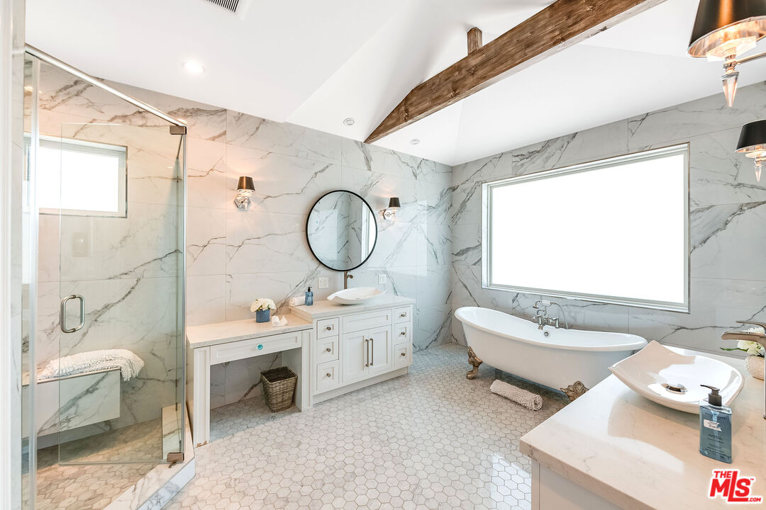 4843 Ledge Avenue Toluca Lake, CA 91601 - Photo 6 of 31 a bathroom with a double vanity sink mirror bathtub and toilet