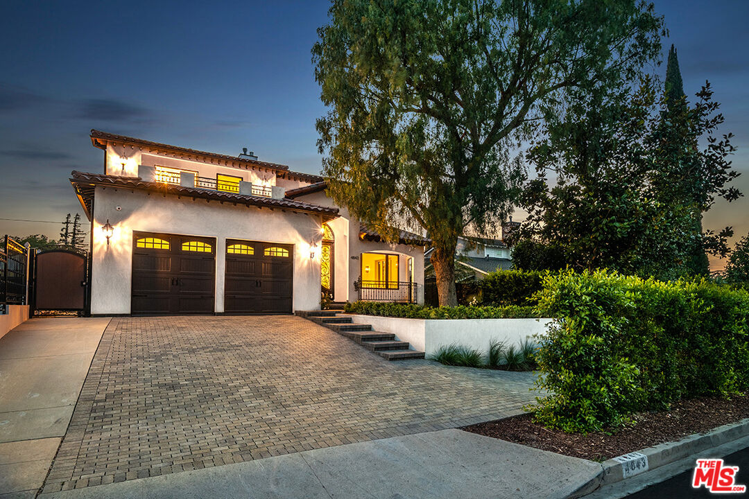 4843 Ledge Avenue Toluca Lake, CA 91601 - Photo 7 of 31 a front view of a house with a yard and outdoor seating