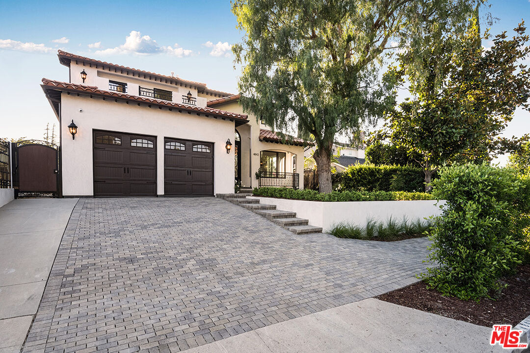 4843 Ledge Avenue Toluca Lake, CA 91601 - Photo 8 of 31 a view of a house with a yard and potted plants
