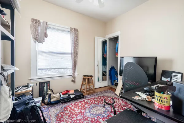 a bedroom with furniture and a window