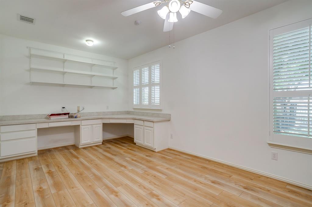 8101 Rodeo Drive Denton, TX 76208 - Photo 36 of 40 4th bedroom has built-in desk and book shelf