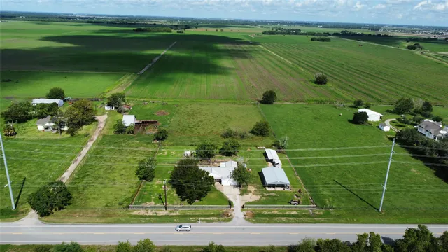 an aerial view of a golf course with parking space