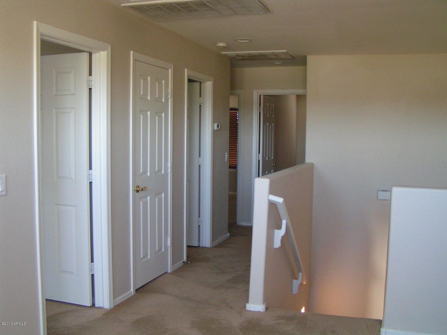 16746 West Adams Street Goodyear, AZ 85338 - Photo 19 of 28 Hallway to 3 of the 4 Bedrooms