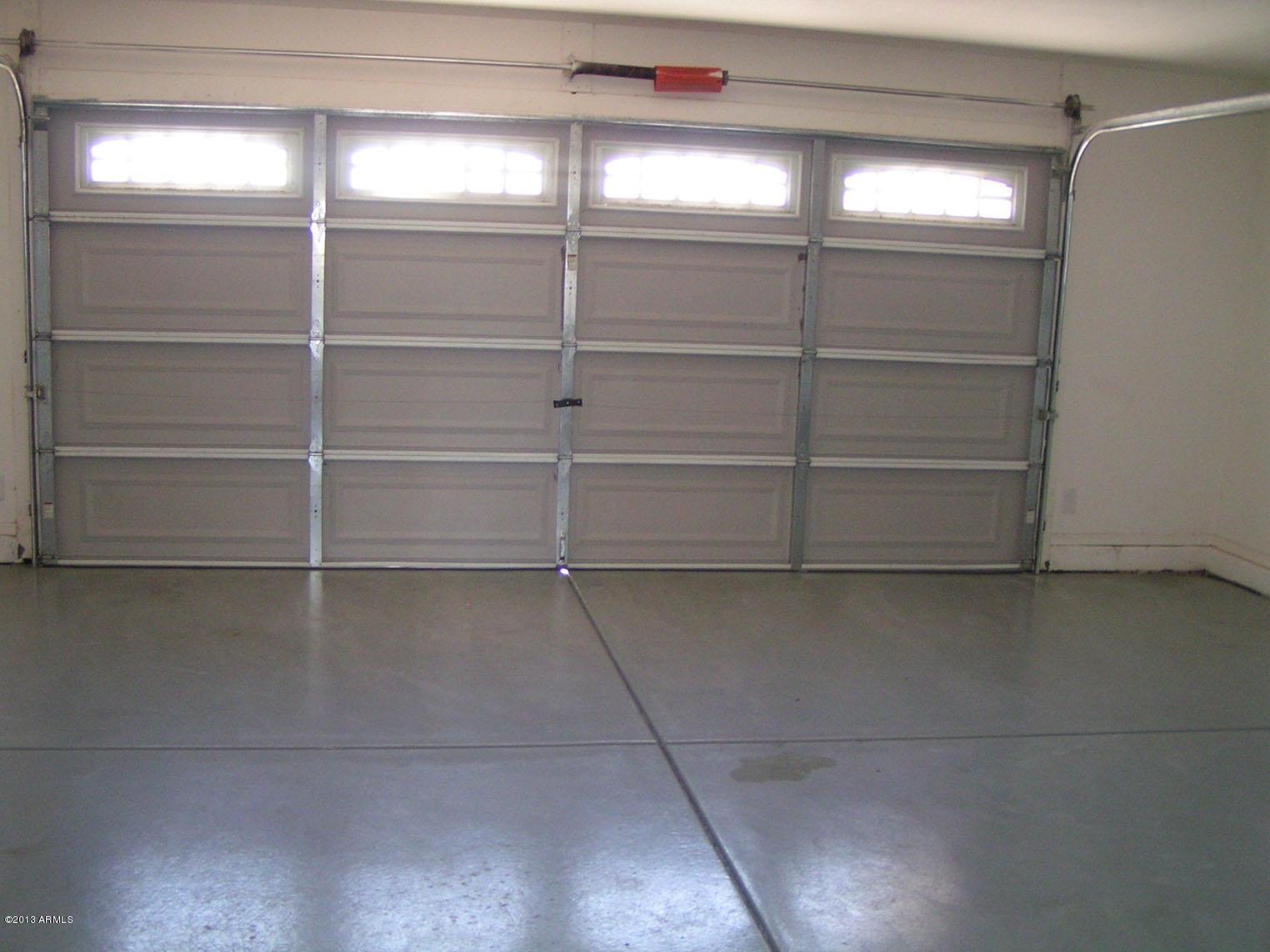 16746 West Adams Street Goodyear, AZ 85338 - Photo 27 of 28 Two Car Garage - Epoxy Floors