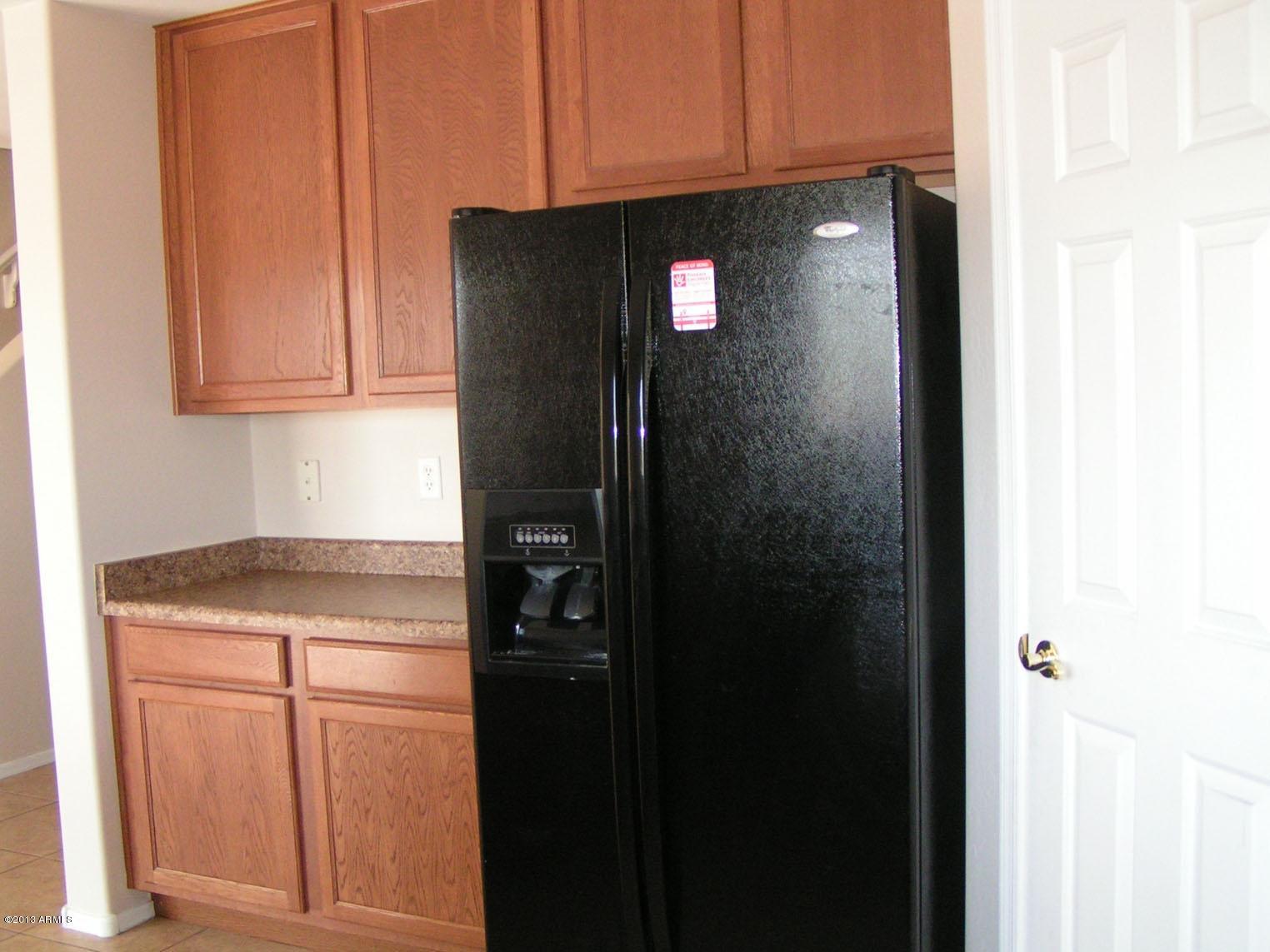 16746 West Adams Street Goodyear, AZ 85338 - Photo 4 of 28 Maple Cabinets