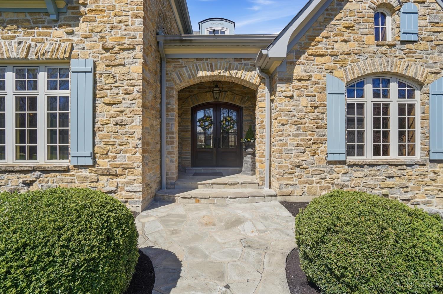 1054 Observatory Point Maineville, OH 45039 - Photo 2 of 82 Beautiful stone walkway and glass double doors under the covered porch greet you as you enter the home.