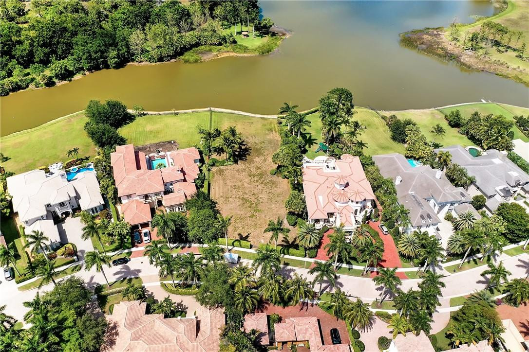 17138 Ave Le Rivage Boca Raton, FL 33496 - Photo 11 of 17 an aerial view of a house with a yard and lake view
