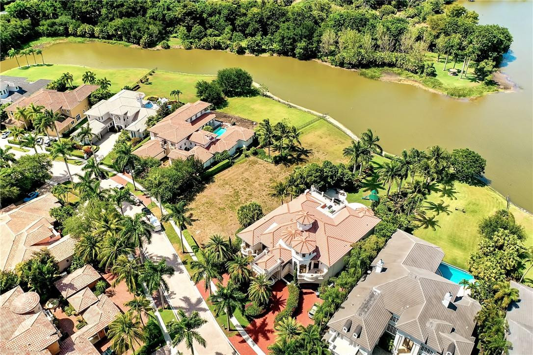 17138 Ave Le Rivage Boca Raton, FL 33496 - Photo 12 of 17 an aerial view of ocean beach and residential houses with outdoor space