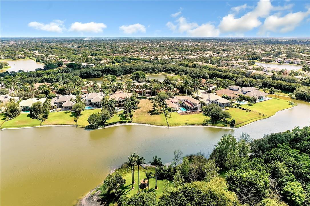 17138 Ave Le Rivage Boca Raton, FL 33496 - Photo 15 of 17 an aerial view of residential houses with outdoor space and lake view