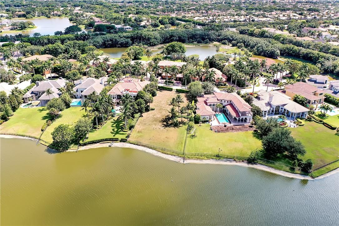 17138 Ave Le Rivage Boca Raton, FL 33496 - Photo 17 of 17 an aerial view of residential houses with outdoor space and parking