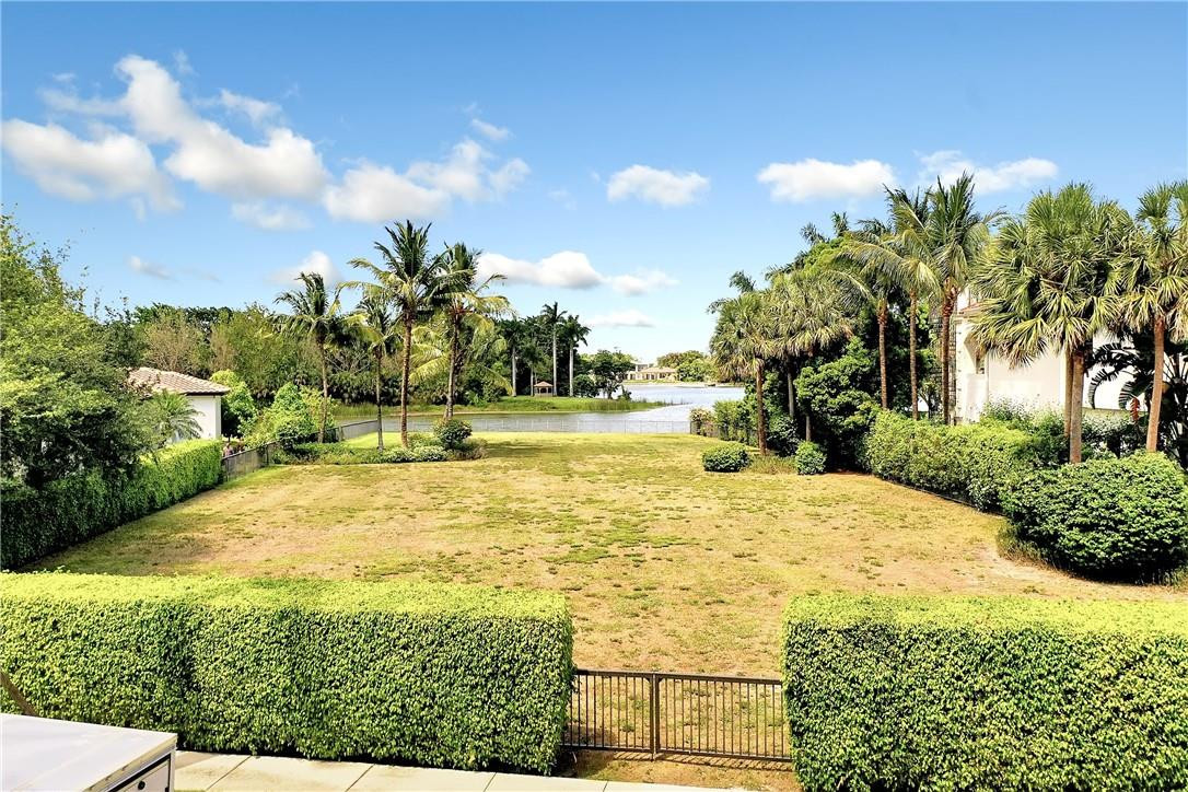 17138 Ave Le Rivage Boca Raton, FL 33496 - Photo 3 of 17 a swimming pool with an outdoor space and seating