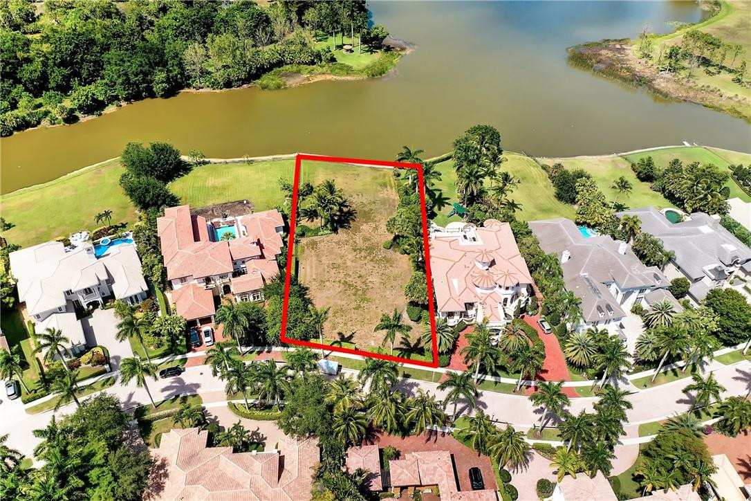 17138 Ave Le Rivage Boca Raton, FL 33496 - Photo 10 of 17 an aerial view of a house with a yard and lake view