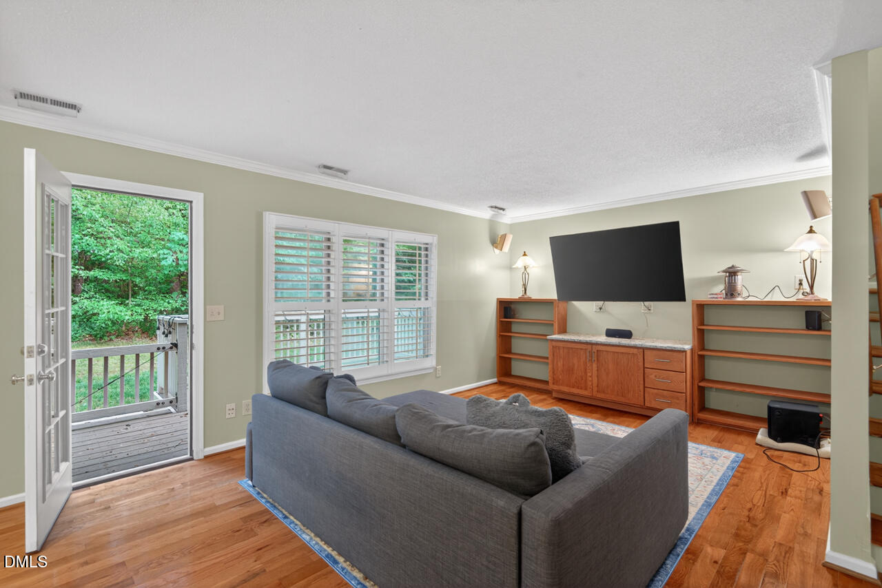 3307 Coachman's Way Durham, NC 27705 - Photo 24 of 50 a living room with furniture and a flat screen tv