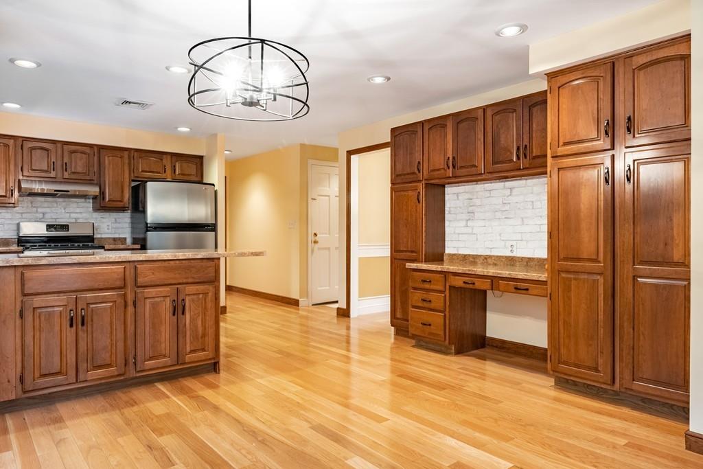 2 Alben Street Winchester, MA 01890 - Photo 13 of 33 a kitchen with stainless steel appliances granite countertop a refrigerator a stove and a sink